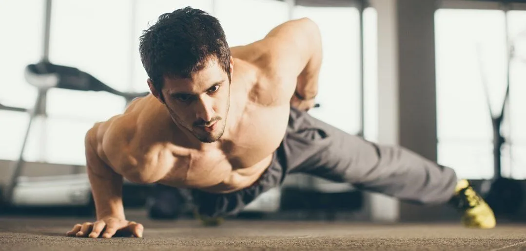 One arm push up - A complete list of Calisthenics exercises. Image credit: www.regularityfitness.com
