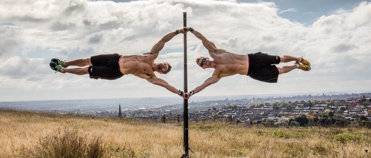 Human flags - A complete list of Calisthenics exercises. Image via School of Calisthenics.