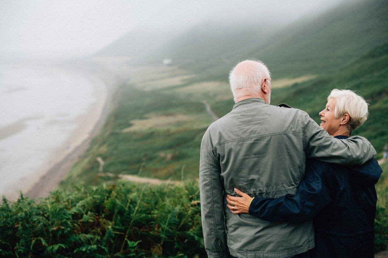 Elderly couple enjoying a walk outdoors