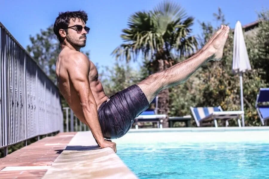 Unsplash: Calisthenics Pike Exercise By Swimming Pool