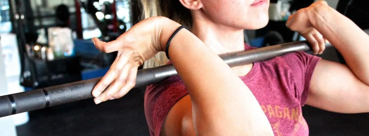 Stock image - women holding a barbell