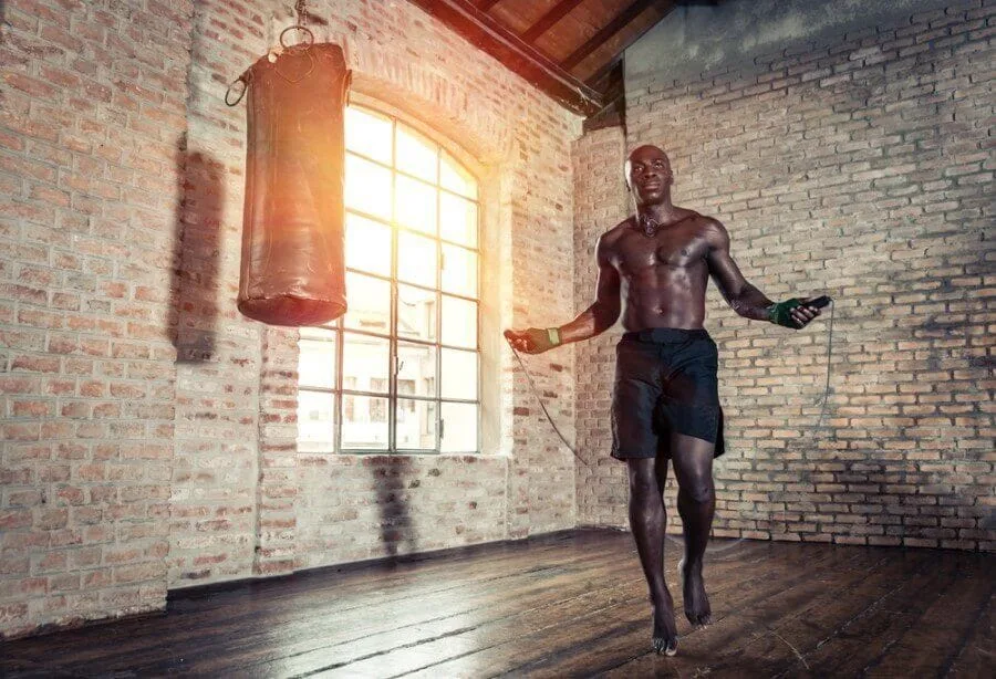 Man skipping in boxing gym