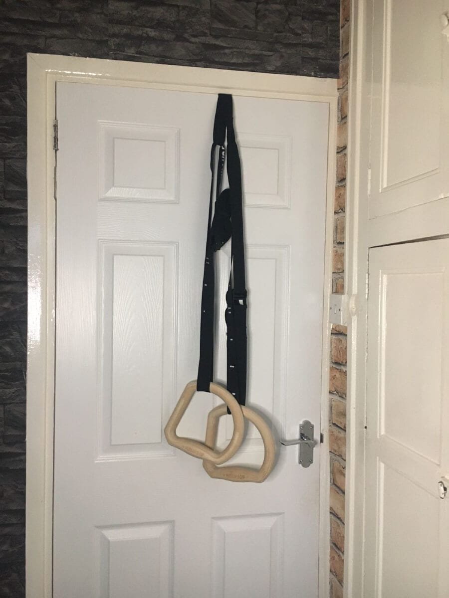 TRINGS hanging on door