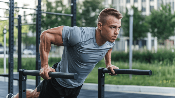 Athletic man performing dips exercise on parallel bars in park setting, demonstrating proper form for calisthenics upper body training